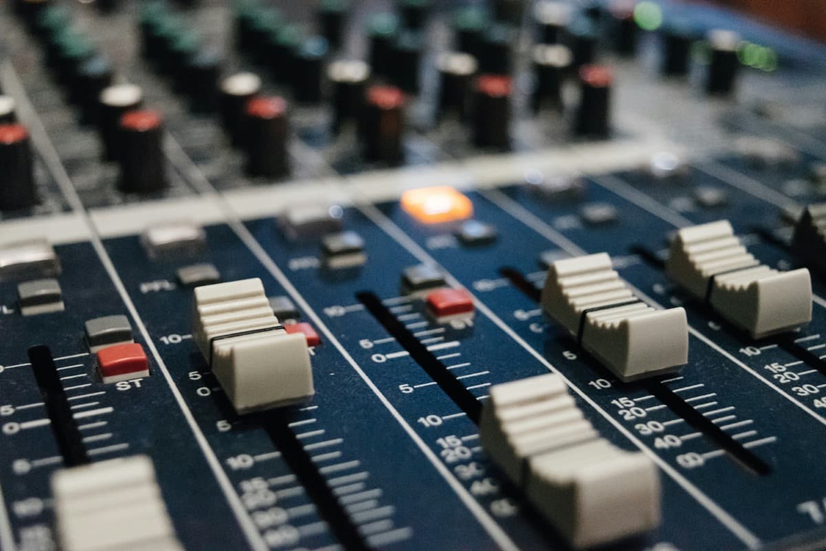 Audio mixing console with faders