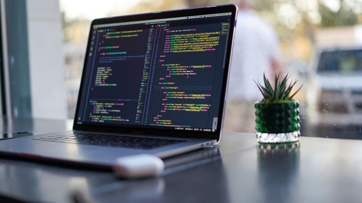 Laptop showing frontend code in an editor
